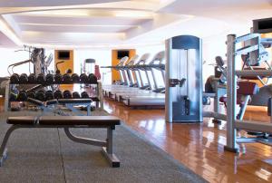 a gym with a bunch of treadmills and machines at The Westin Dhaka in Dhaka