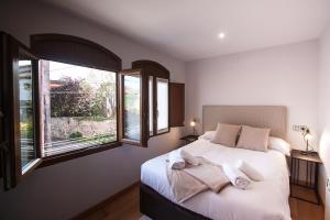 A bed or beds in a room at Busgosu, casa a 300 m de la playa de Poo VV-993-AS