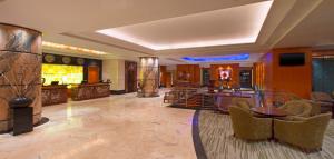 a room with a lobby with a table and chairs at The Westin Dhaka in Dhaka