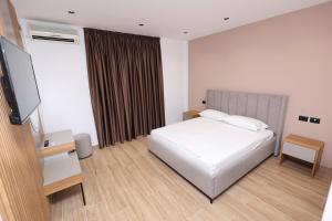 Postel nebo postele na pokoji v ubytování Emar Hotel