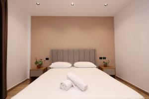 Postel nebo postele na pokoji v ubytování Emar Hotel