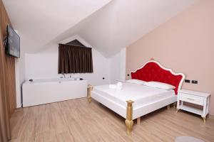 Postel nebo postele na pokoji v ubytování Emar Hotel