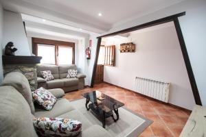 A seating area at Busgosu, casa a 300 m de la playa de Poo VV-993-AS