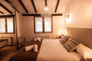 A bed or beds in a room at Busgosu, casa a 300 m de la playa de Poo VV-993-AS