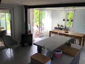 a kitchen with a table and a stove in it at La Tournerie de Valis in Clairvaux-les-Lacs +9 photos