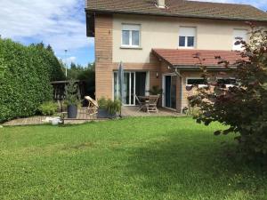 a house with a lawn in front of it at La Tournerie de Valis in Clairvaux-les-Lacs