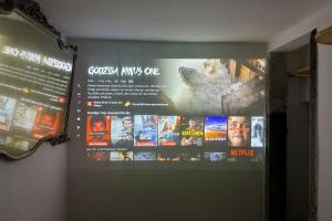 a sign on a wall with movies on it at Cinque Terre - House & Garden Paradise in Volastra