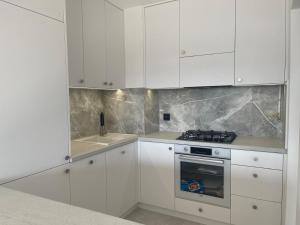 Kuchyňa alebo kuchynka v ubytovaní Happy Apartaments