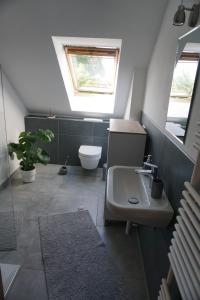 Koupelna v ubytování Ferienwohnung in 18107 Elmenhorst kurz vor Warnemünde