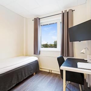 Postel nebo postele na pokoji v ubytování Centralhotellet