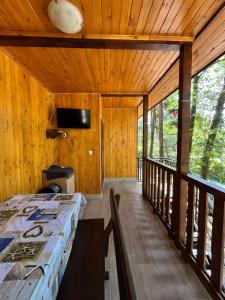 a bedroom with a bed and a balcony at к-г Луна к-с Лонгоза комплекс Лонгоза in Byala
