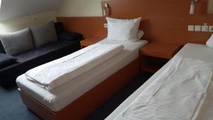 Postel nebo postele na pokoji v ubytování Hotel Nord