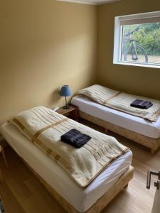 Postel nebo postele na pokoji v ubytování Guesthouse Steinsholt
