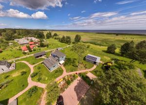 an aerial view of a house in a field at 2bedroom house in Mērsrags