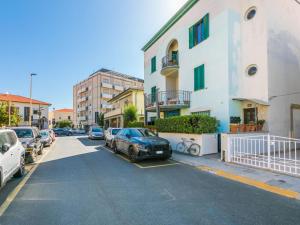 a car parked in a parking lot next to a building at Apartment Maestrale by Interhome in Marina di Cecina