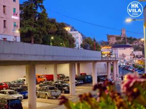 a parking lot with cars parked in a parking lot at Vila HK in Krujë