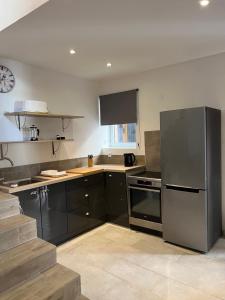 Kuchyň nebo kuchyňský kout v ubytování Charmante maison de village