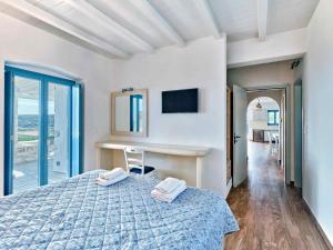 Ένα ή περισσότερα κρεβάτια σε δωμάτιο στο Luxurious Villa Seirios