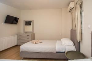Postel nebo postele na pokoji v ubytování GM Villa Kallithies Village