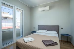 Postel nebo postele na pokoji v ubytování GM Villa Kallithies Village