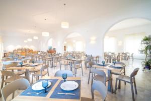 a dining room with wooden tables and chairs at Hotel La Terraza in Sanxenxo