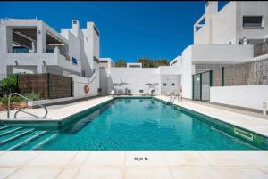 a swimming pool in front of a building at Casa Elah - Luxury Villa in Nerja