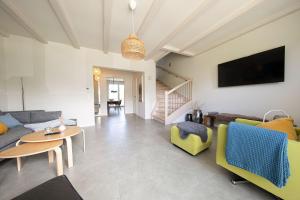 TV a/nebo společenská místnost v ubytování Ferienhaus Seeherz