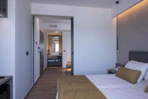 Postel nebo postele na pokoji v ubytování Creta Palm Resort Hotel & Apartments