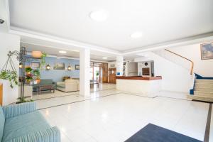 a living room with a staircase in a house at Hotel La Terraza in Sanxenxo +87 photos