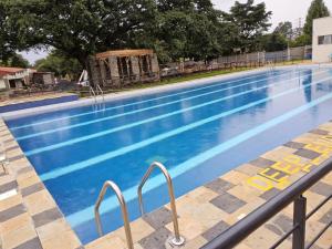 a swimming pool with blue water at Jsons executive suites in Nairobi
