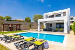 an image of a villa with a swimming pool at Villa Dionysos in Lachania