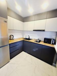 Køkken eller tekøkken på Бухар Жирау 44