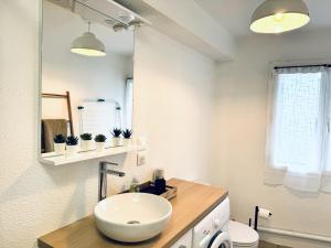 a white bathroom with a sink and a mirror at Le Golden Lake-5min du LAC à pied-Parking privé gratuit in Sévrier +27 photos