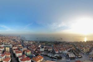an aerial view of a city with buildings and the ocean at The Grand Mira Business Hotel in Istanbul
