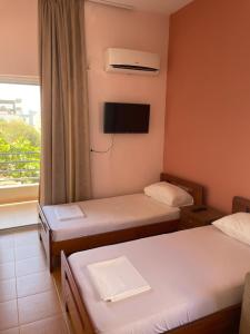 Postel nebo postele na pokoji v ubytování Bleta Rooms