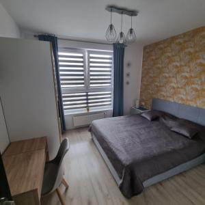 Posteľ alebo postele v izbe v ubytovaní Apartamenty Morze on Sea