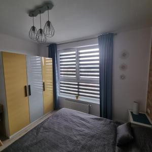 Posteľ alebo postele v izbe v ubytovaní Apartamenty Morze on Sea