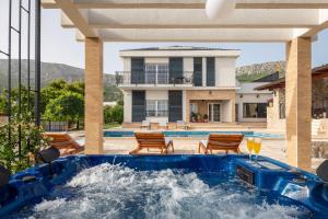 a pool in the backyard of a house at Villa Zvonimir in Klis