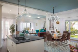 a kitchen and living room with a sink and a table at Villa Zvonimir in Klis