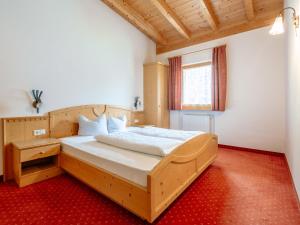 Postel nebo postele na pokoji v ubytování Apartment Nr- 18 by Interhome
