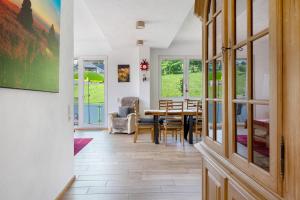 a dining room with a table and chairs at Sport Rees- Ferienwohnung Ulrich in Hofsgrund