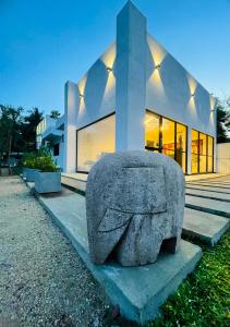 a stone elephant statue in front of a building at The Ivy Lake in Anuradhapura