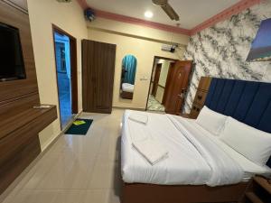 Postel nebo postele na pokoji v ubytování Three Dot Hotel