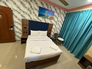 Postel nebo postele na pokoji v ubytování Three Dot Hotel