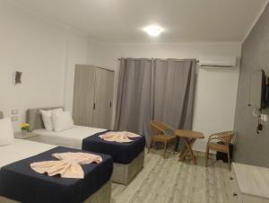 Una cama o camas en una habitación de فندق القاهره