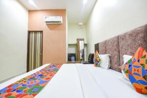 a bedroom with a large bed in a room at Via Galaxy in Chandīgarh