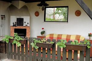 a living room with a couch and some plants at U Kotálů in Podmokly