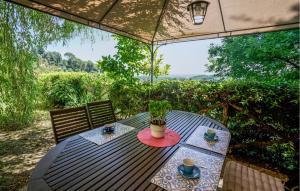 a wooden table with a plant on top of it at Beautiful Home In Serravalle Pistoiese in Serravalle Pistoiese