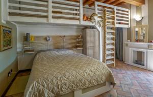 a bedroom with a bed and bunk beds in a room at Beautiful Home In Serravalle Pistoiese in Serravalle Pistoiese