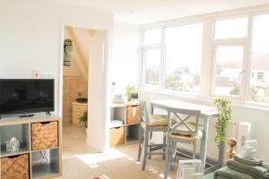 TV a/nebo společenská místnost v ubytování B’s Place Guest House